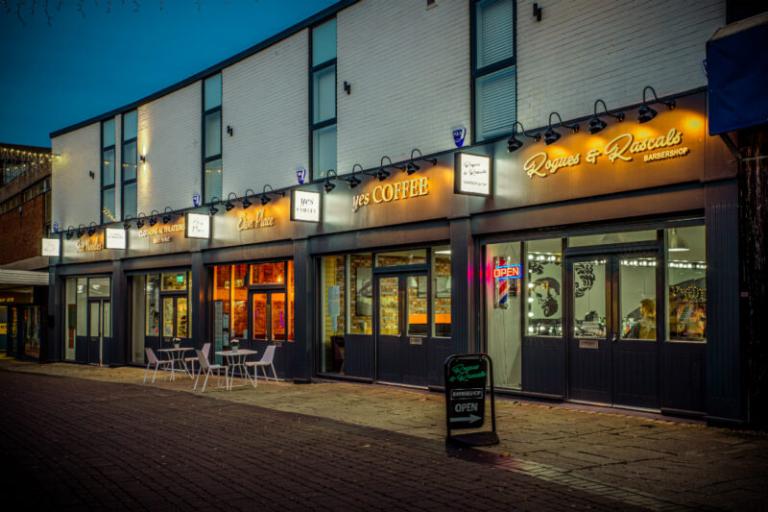 Shops in Huyton village at night. 