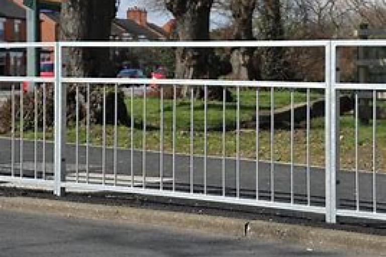 Picture of guardrails on the side of  a road. 