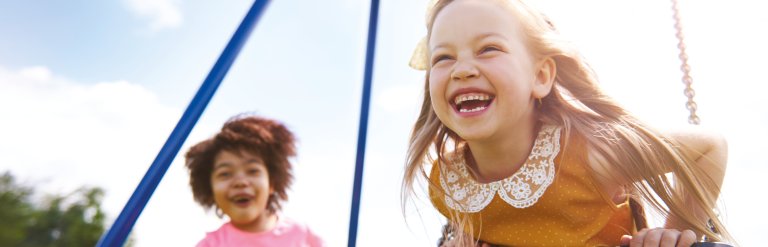 Photograph showing 2 young children playing outdoors