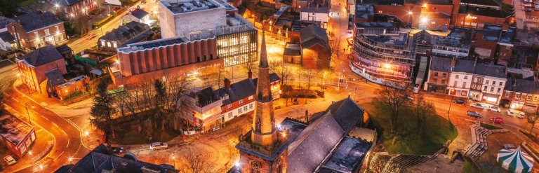 Photograph showing an arial view of Knowsley at night
